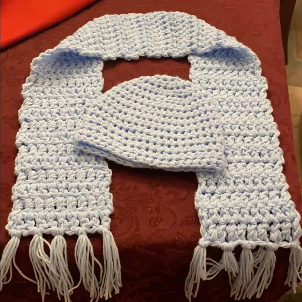 homemade crocheted baby blue hat and scarf set